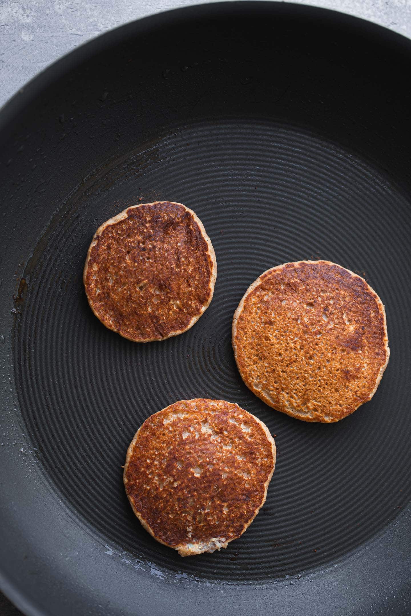 Vegan pancakes in a large pan