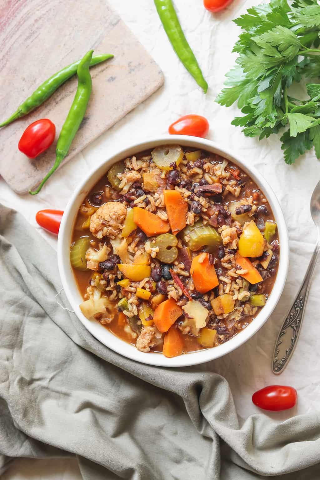 comforting vegan rice soup with vegetables and black beans
