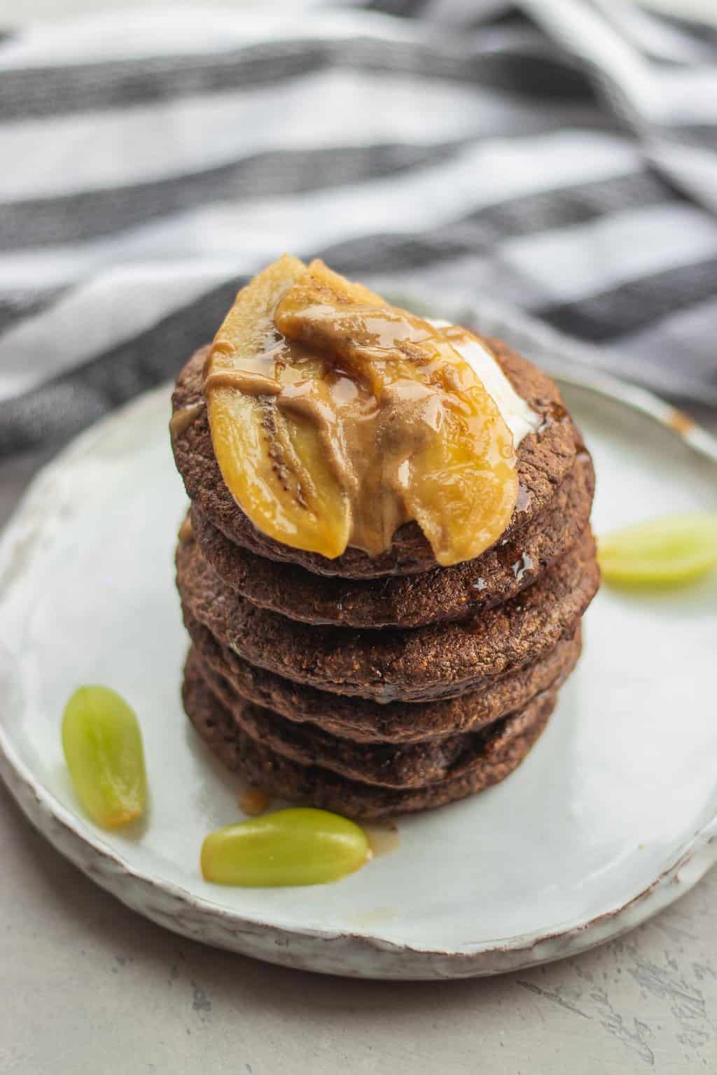 Cacao fluffy vegan pancake stack with banana and tahini
