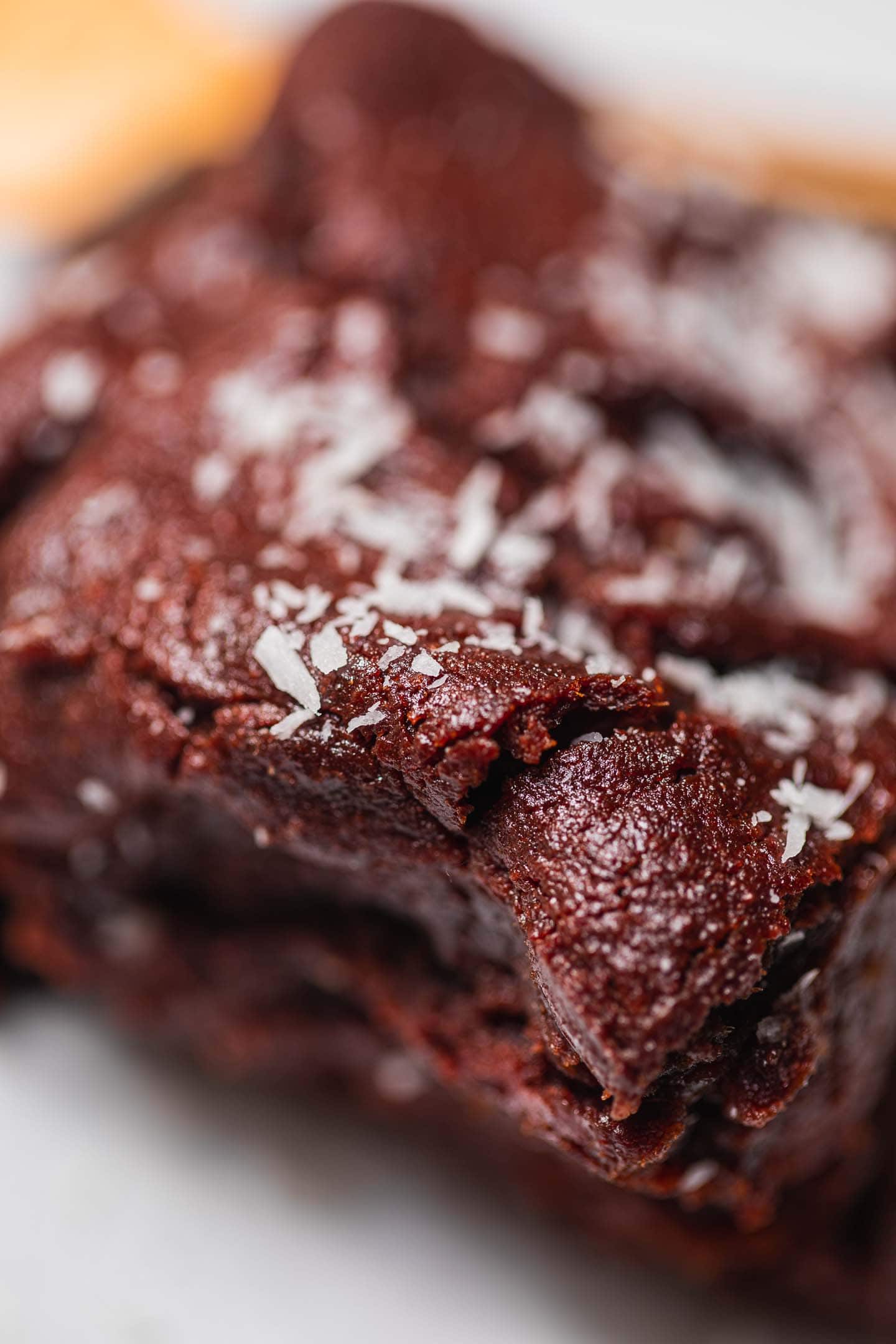 Closeup of a brownie with desiccated coconut on top