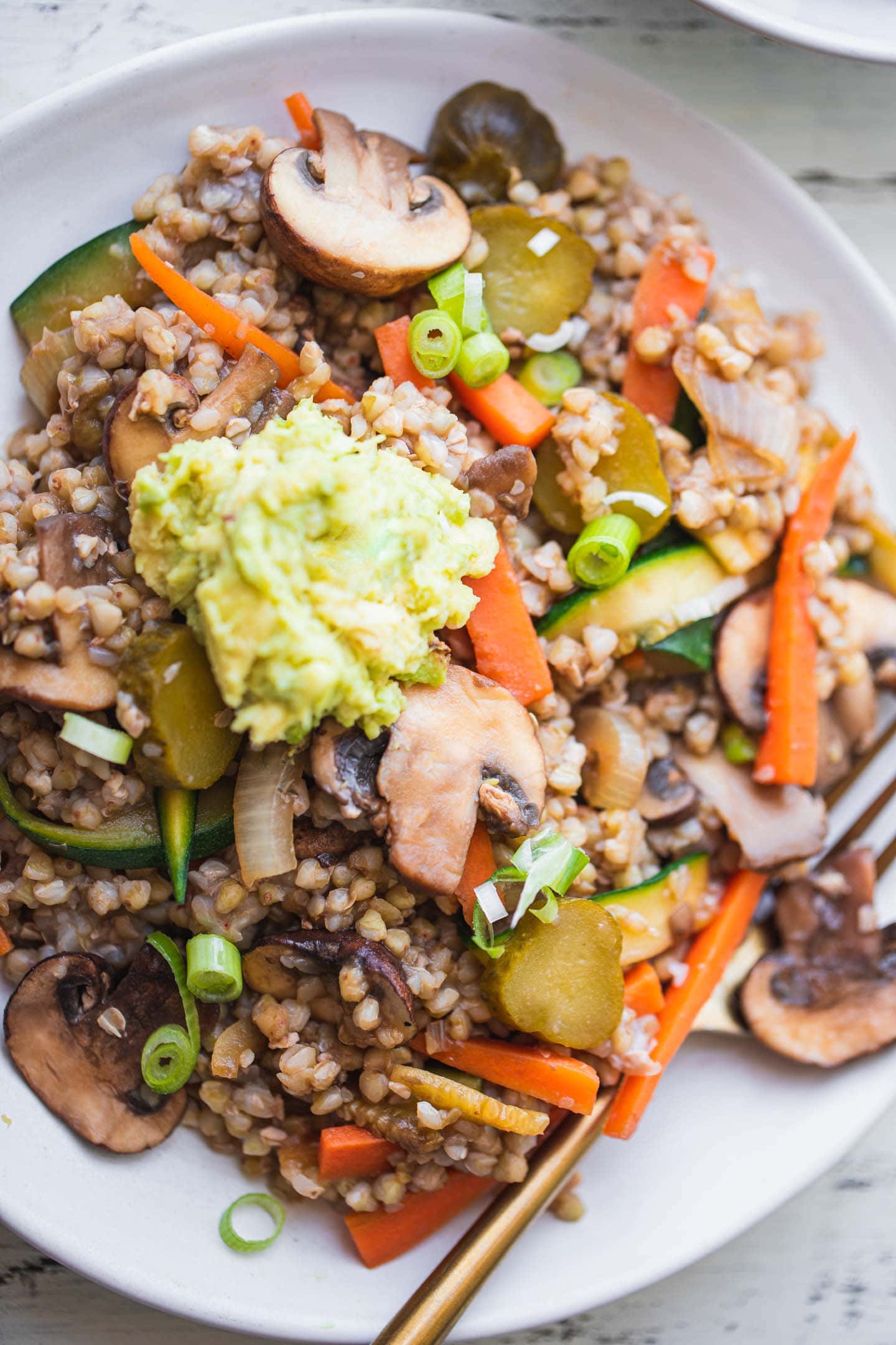 Vegan buckwheat bowl with vegetables and avocado