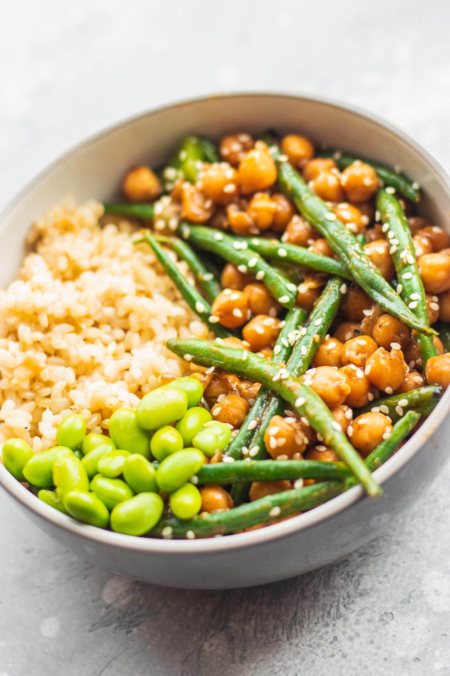 Bowl with sweet and sour chickpeas, green beans and edamame