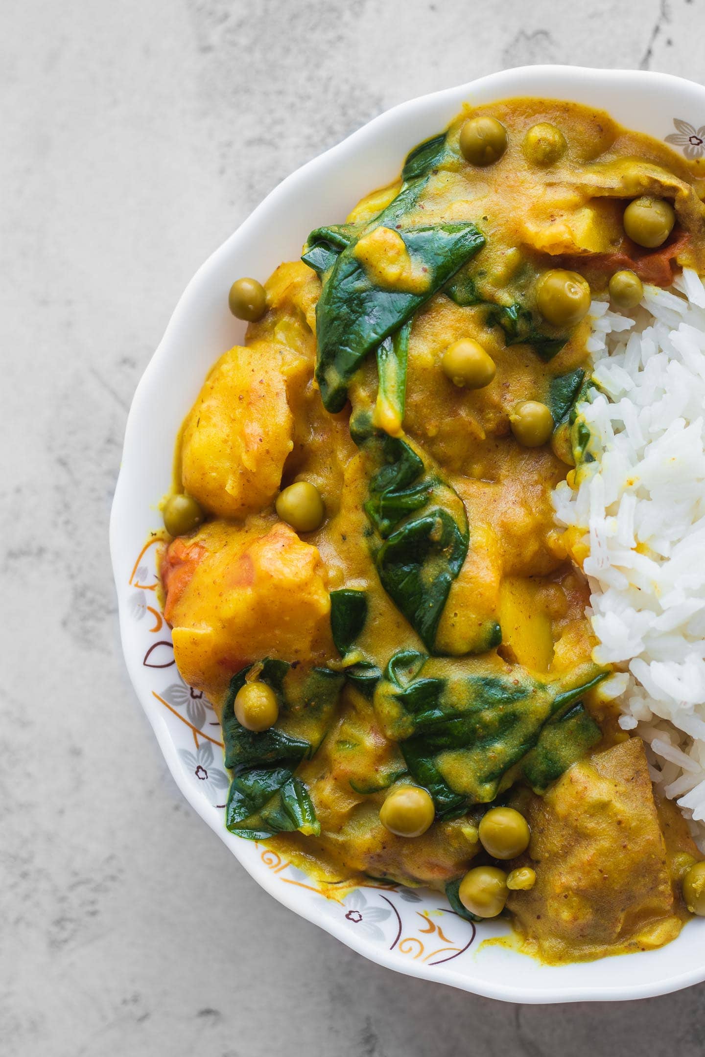 Closeup of vegan curry with potatoes and rice