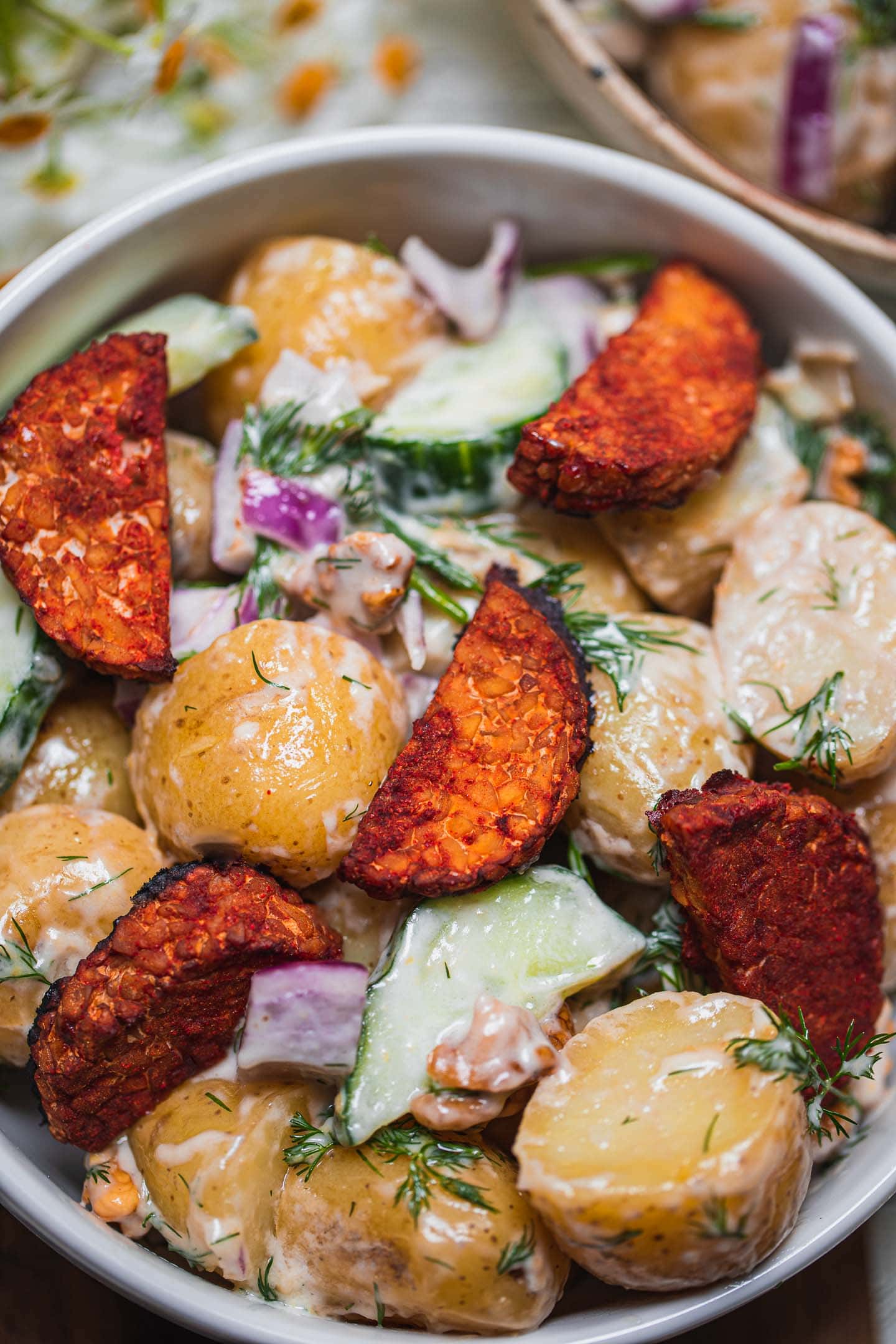 Closeup of a vegan salad with potatoes and tempeh