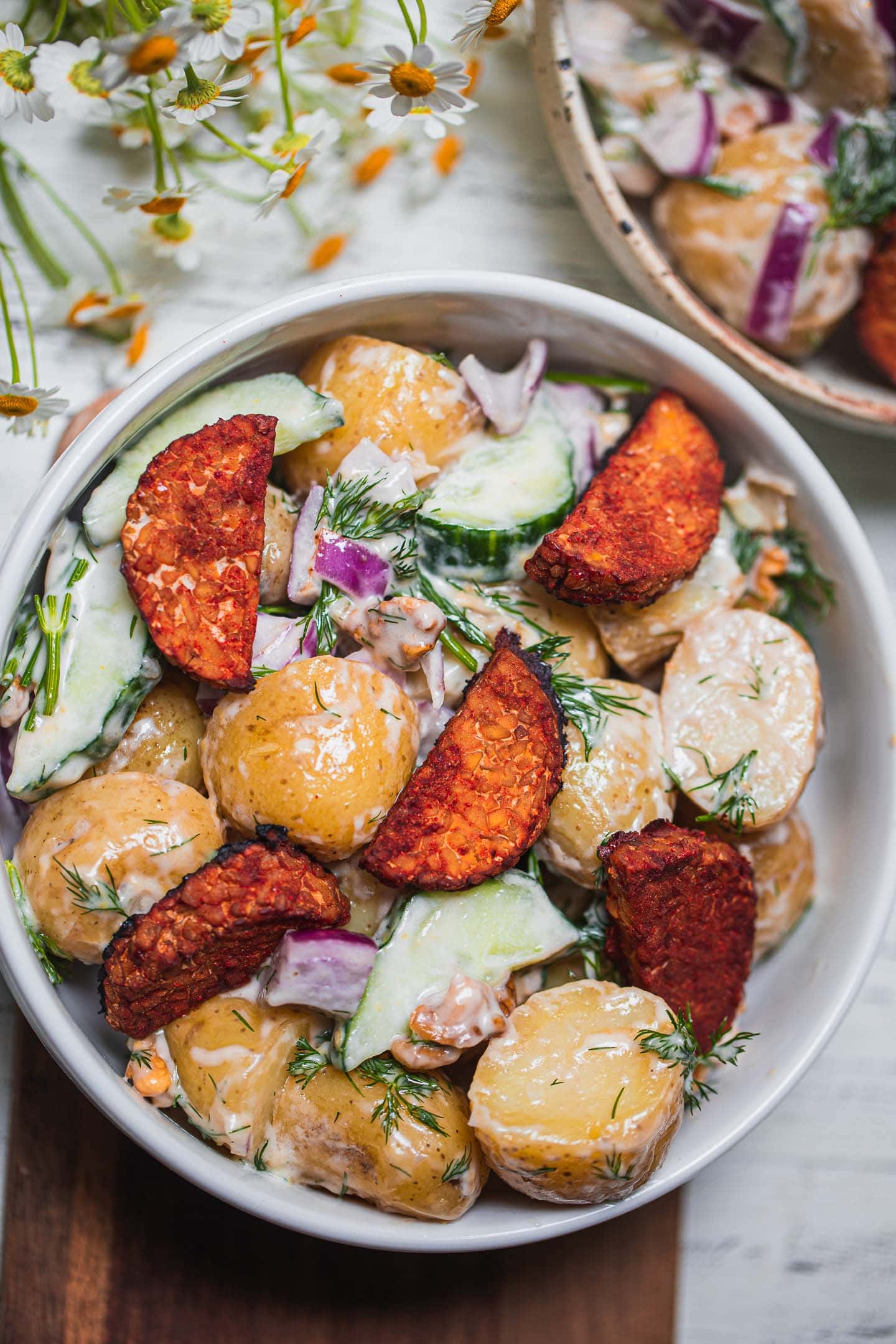 Bowl with dairy-free potato salad and tempeh bites