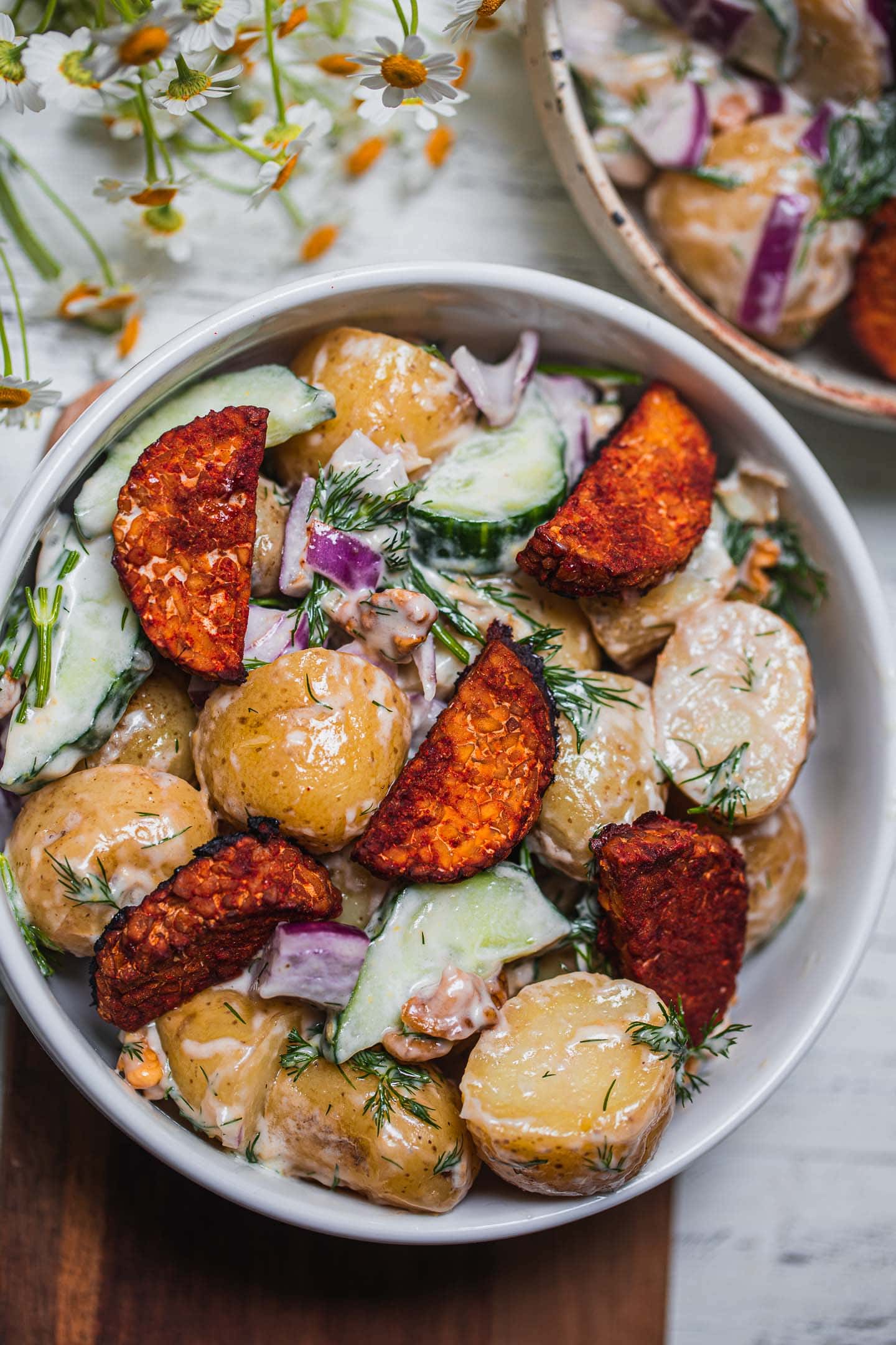 Vegan potato salad with herbs and tempeh
