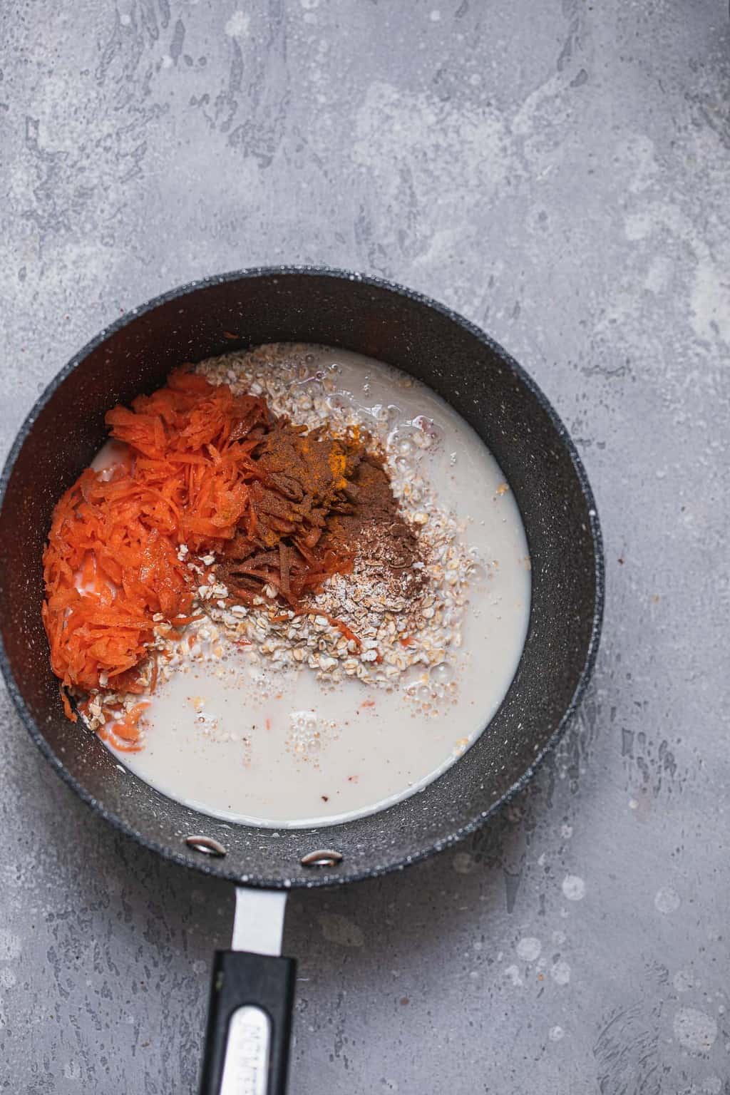 Vegan porridge ingredients in a saucepan