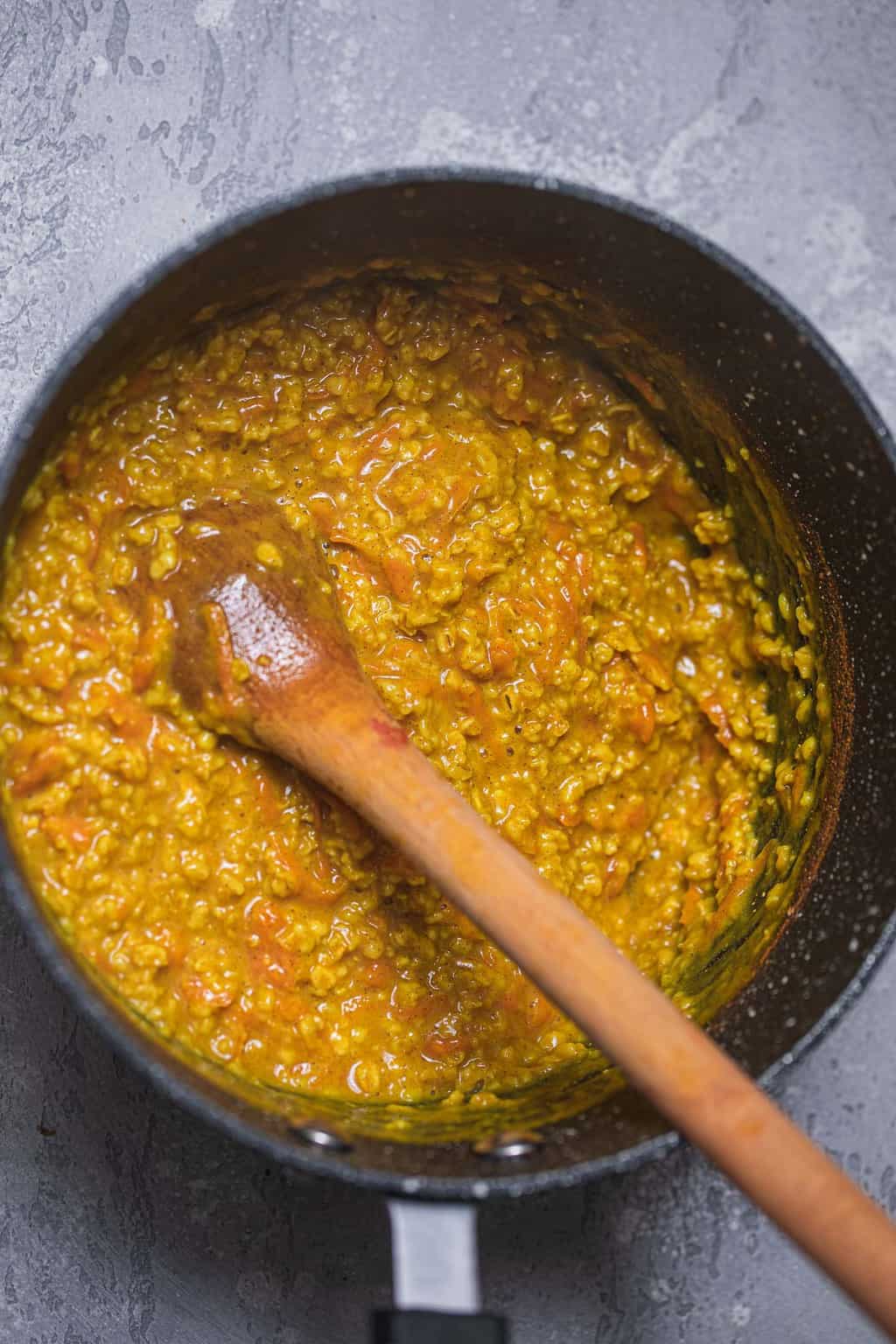 Turmeric and carrot porridge in a saucepan