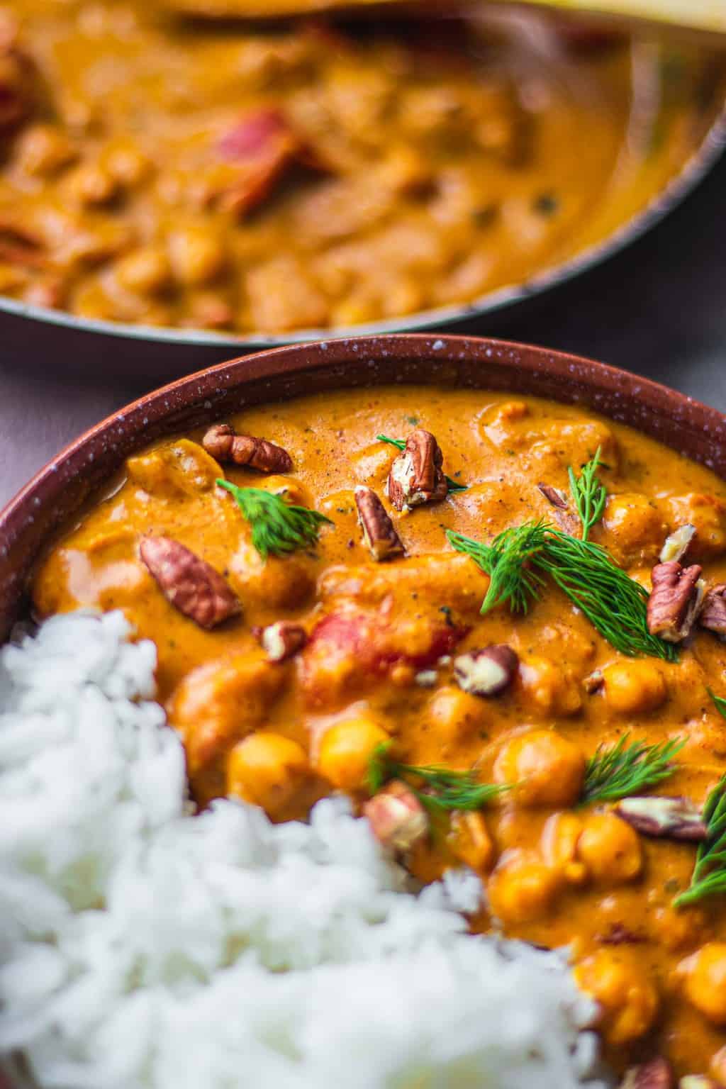 Bowl of vegan chickpeas in a curry sauce