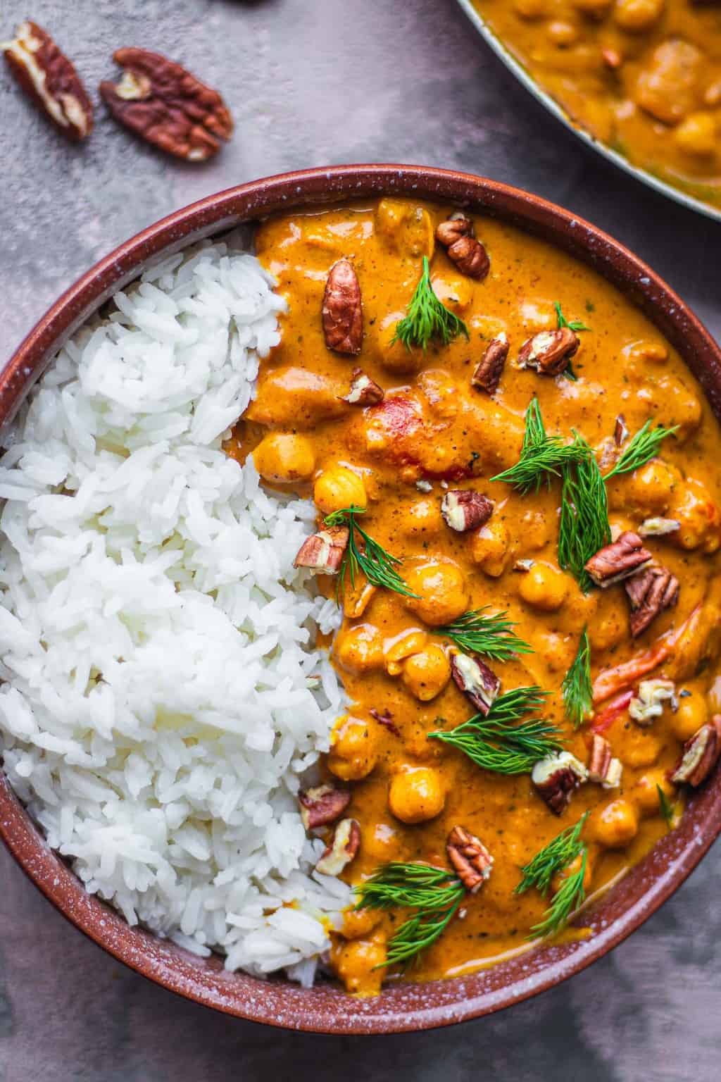 Bowl with chickpeas in a curry sauce over rice