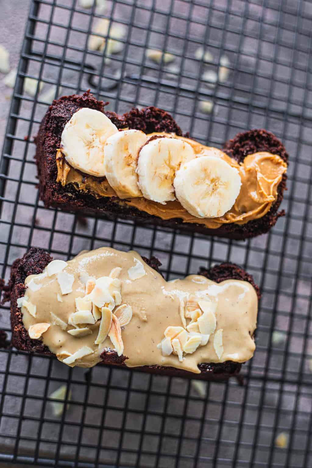 Two slices of vegan banana bread with peanut butter and tahini