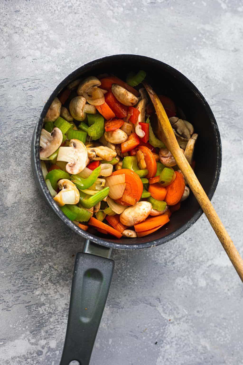 Mushrooms and vegetables in a saucepan