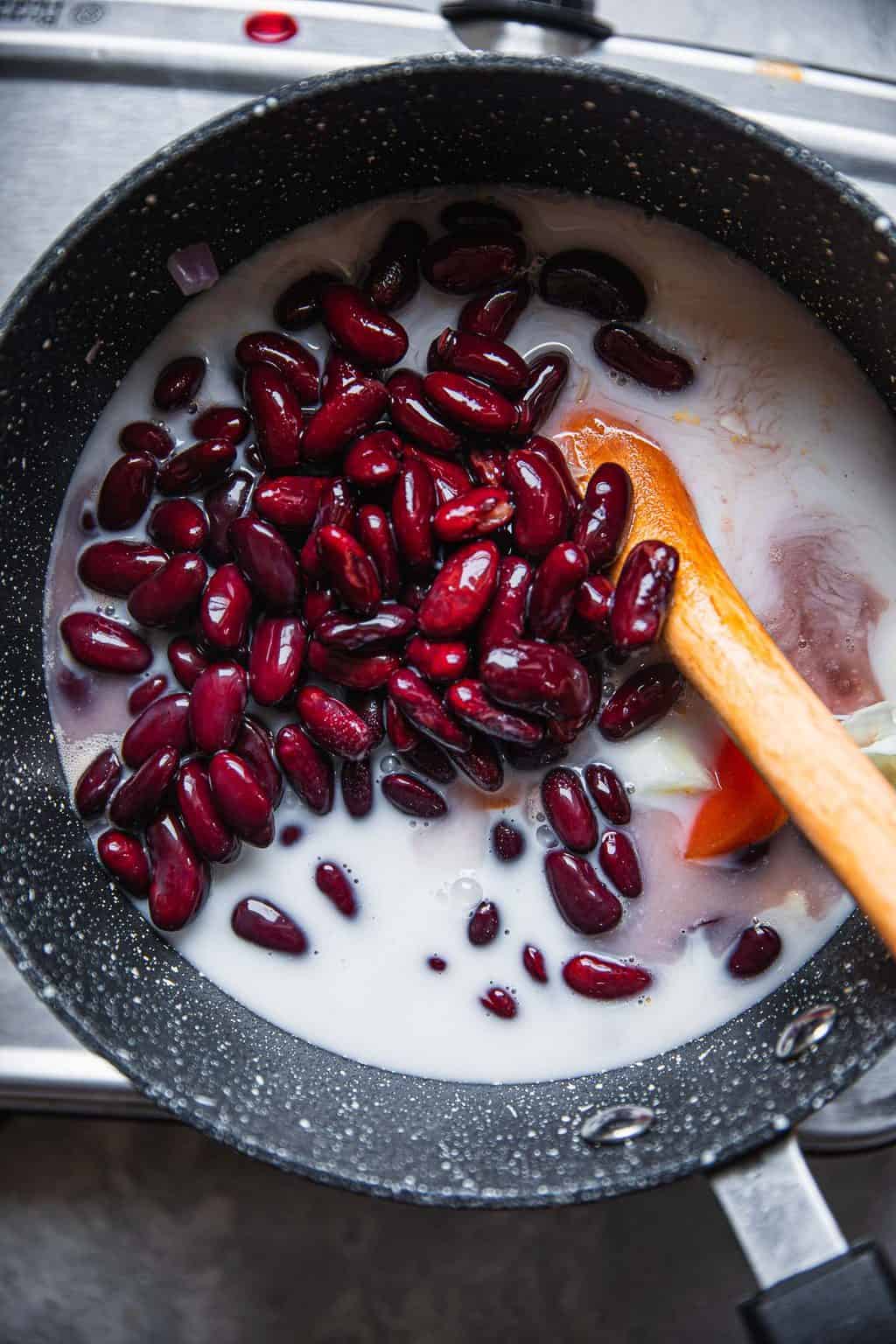 Red beans and plant based milk in a saucepan