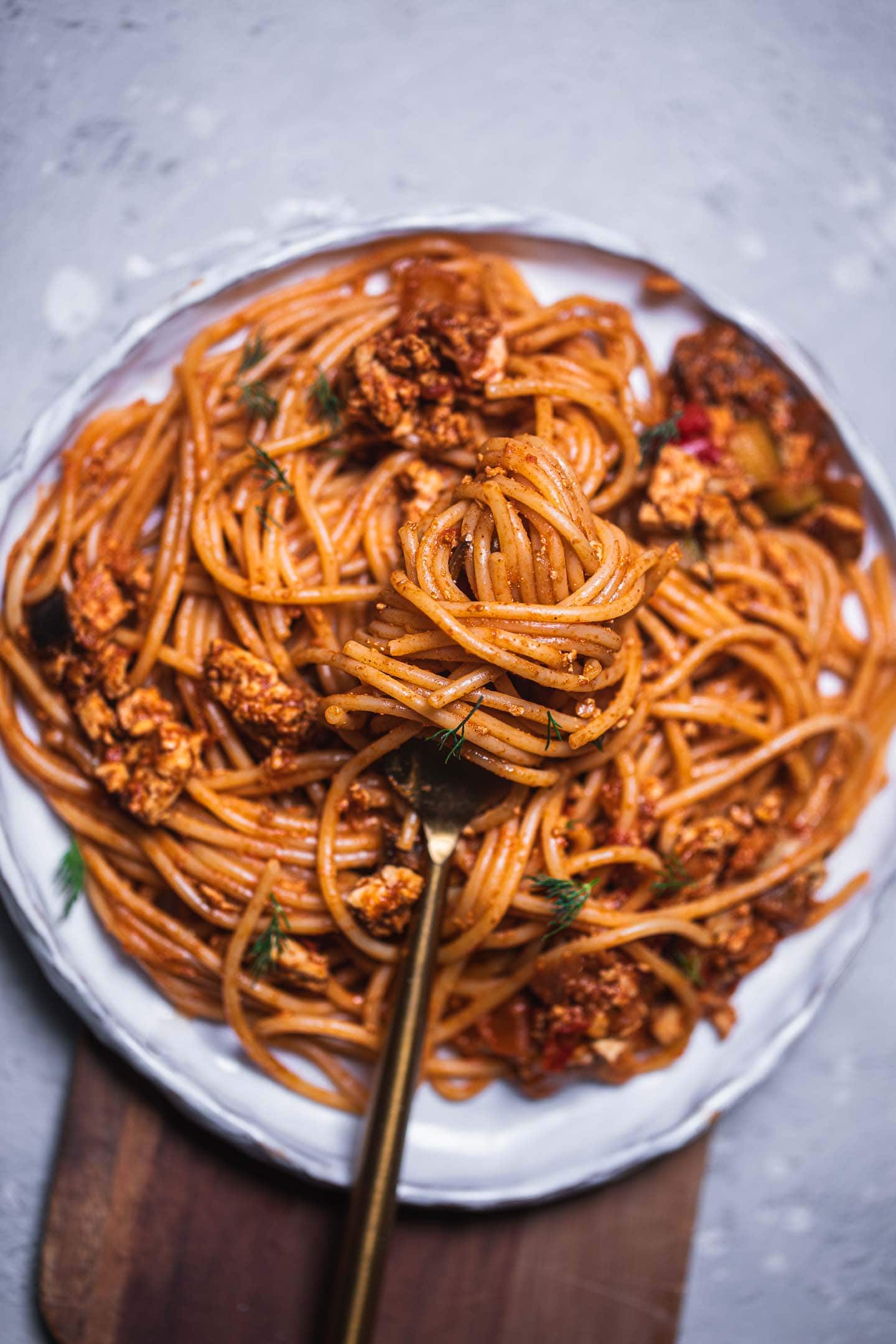 Pasta on a plate with tofu and vegetables