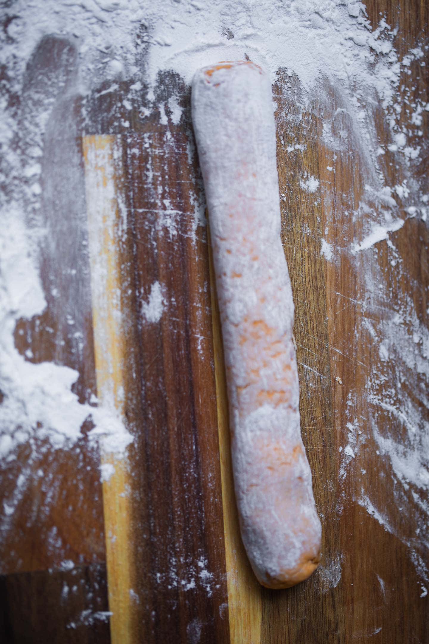 Sweet potato gnocchi dough on a chopping board