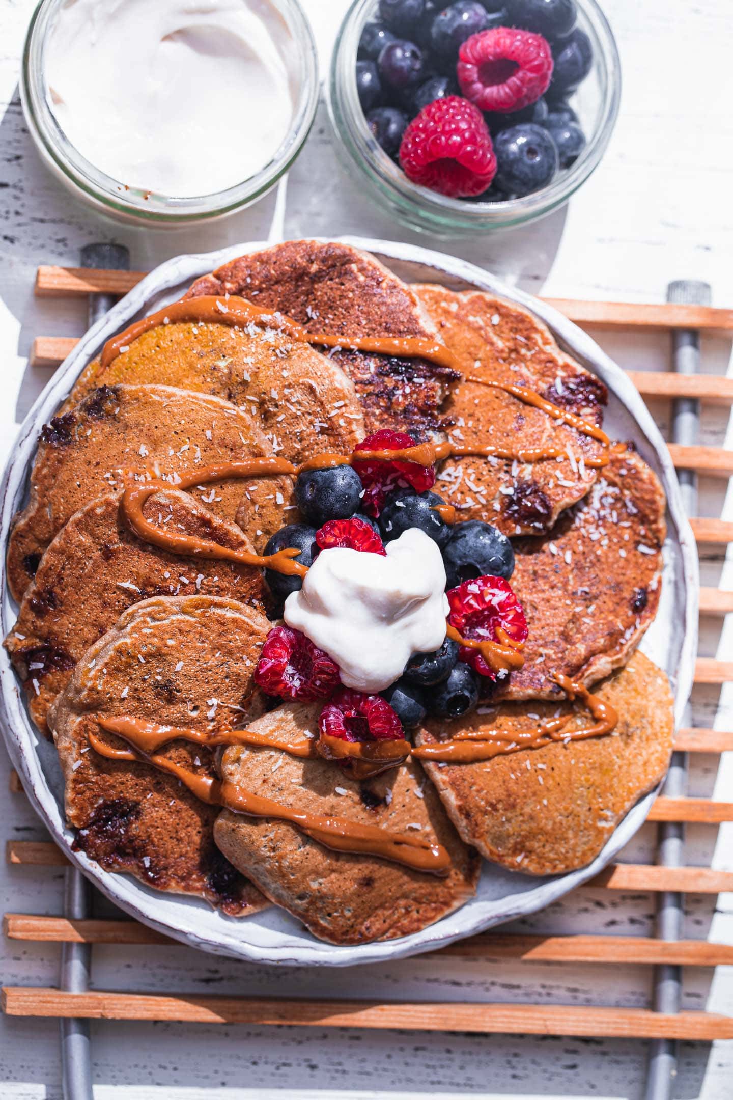 Vegan pancakes with berries and peanut butter