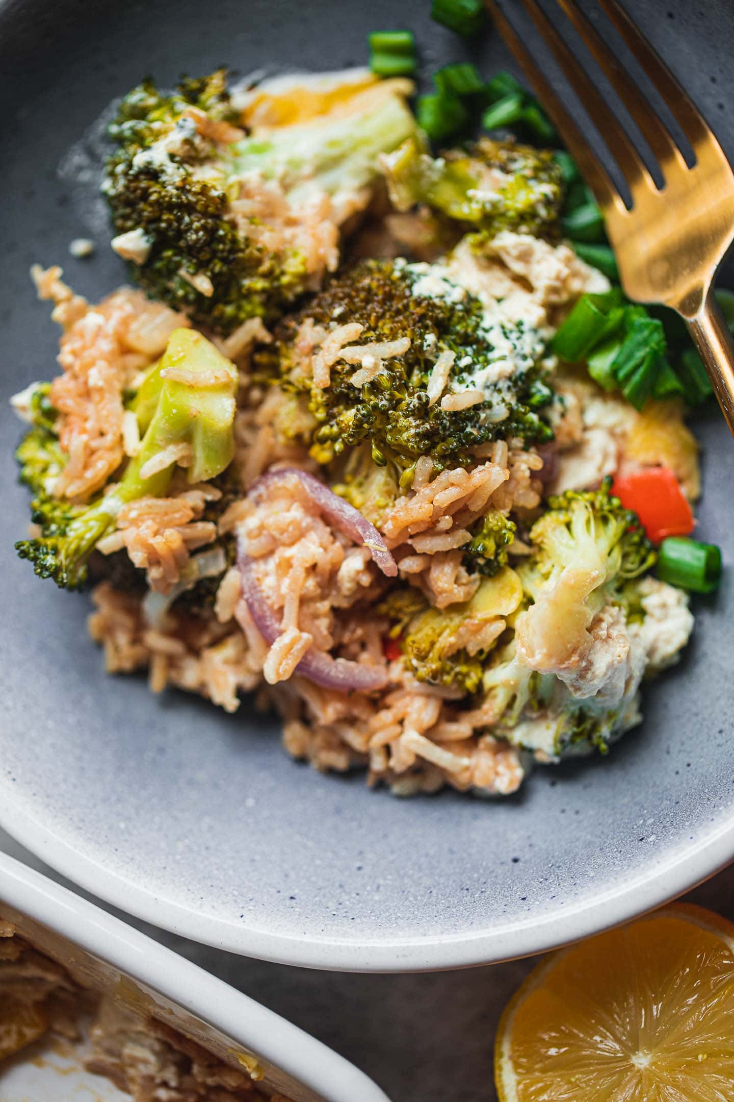 Vegan casserole with broccoli and rice in a blue bowl