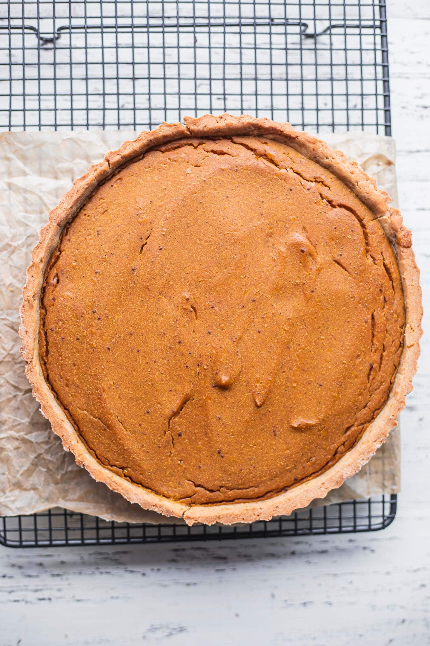Dairy-free pumpkin pie on a cooling rack