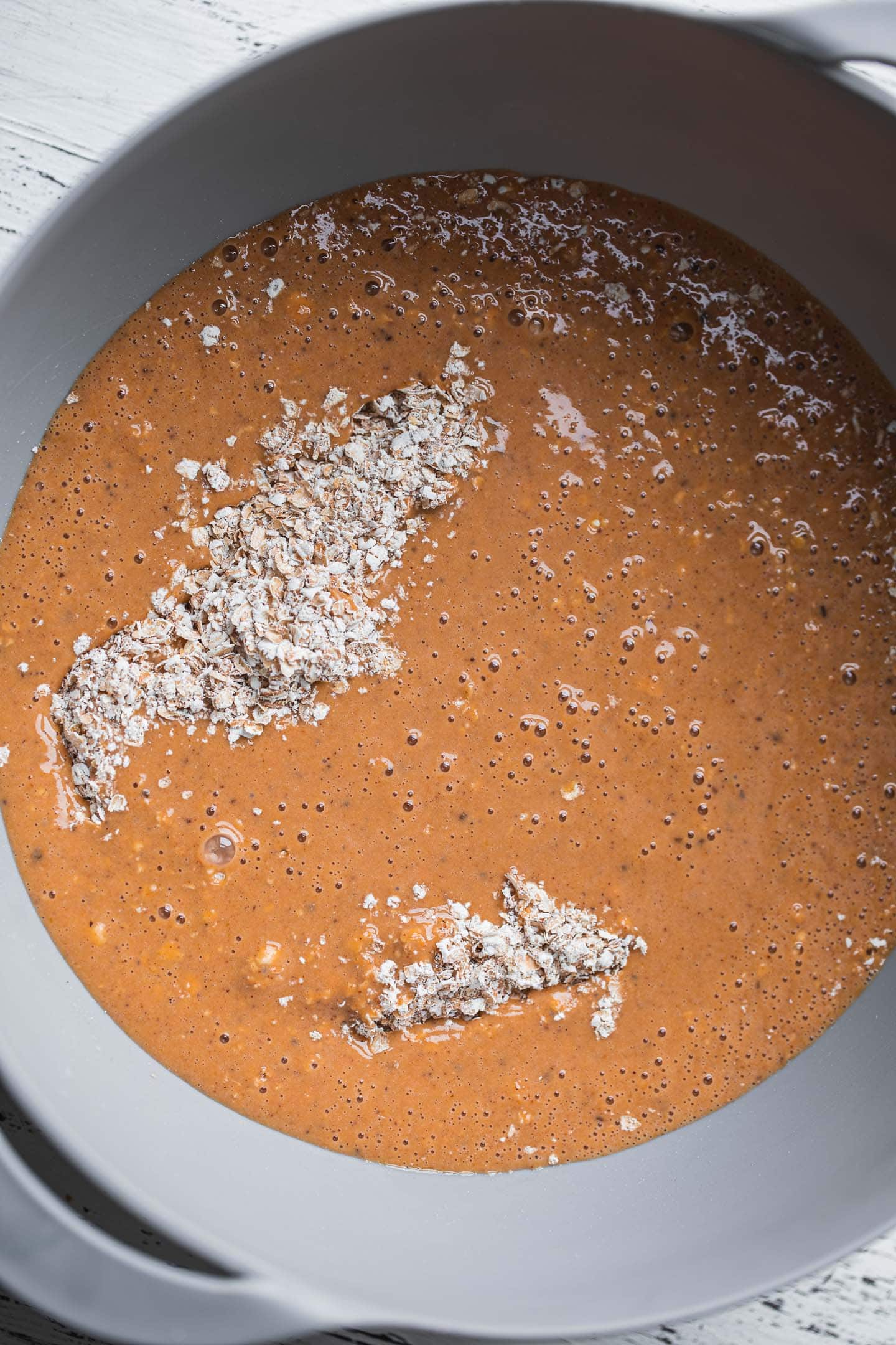Pumpkin pie baked oats in a mixing bowl
