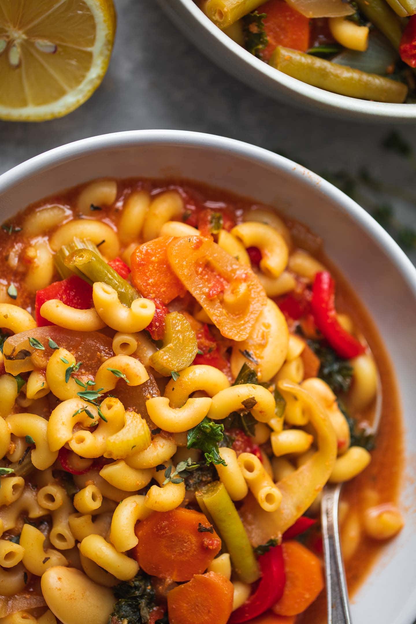 Bowl of vegetable soup with pasta and butter beans