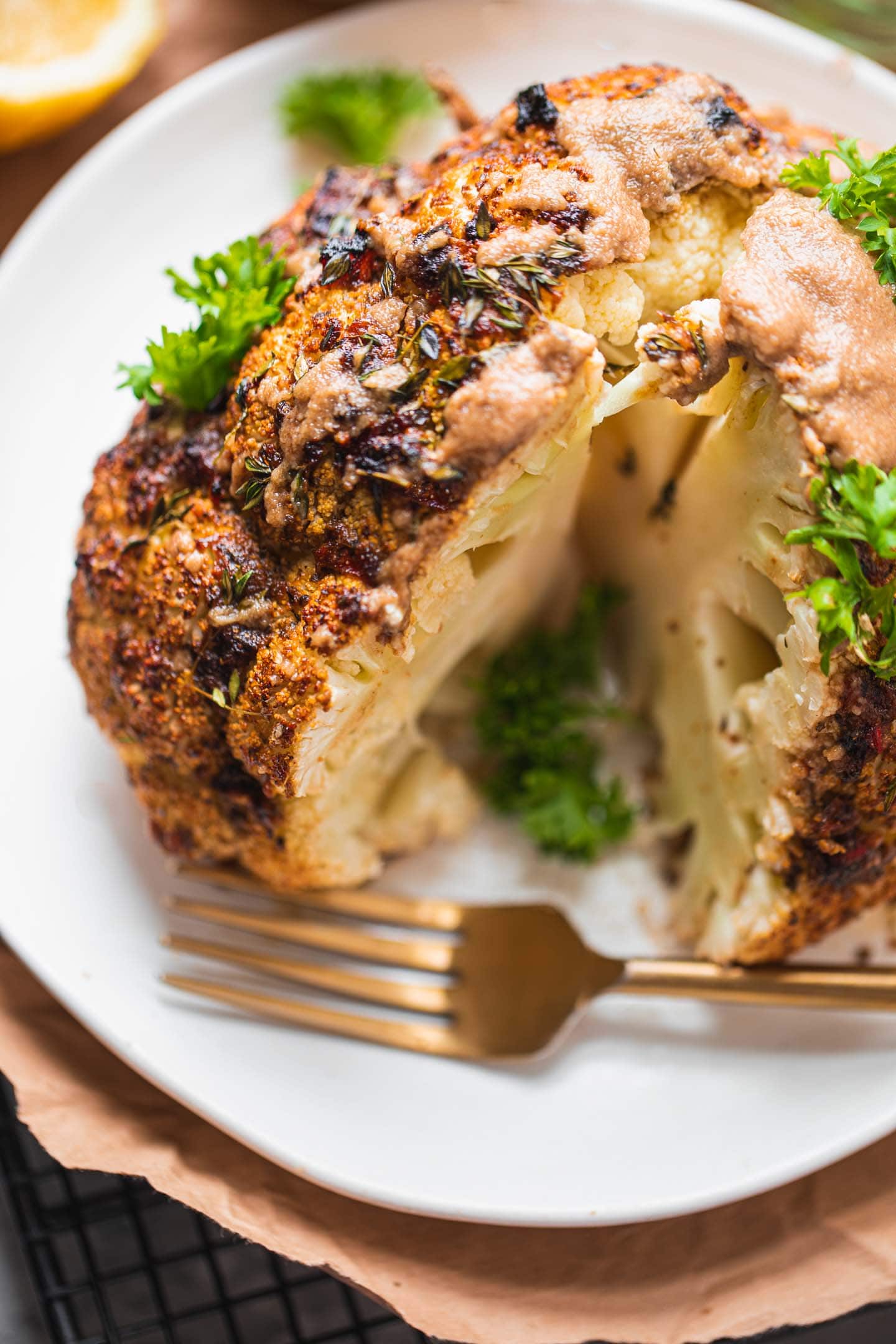 Roasted cauliflower on a plate with herbs