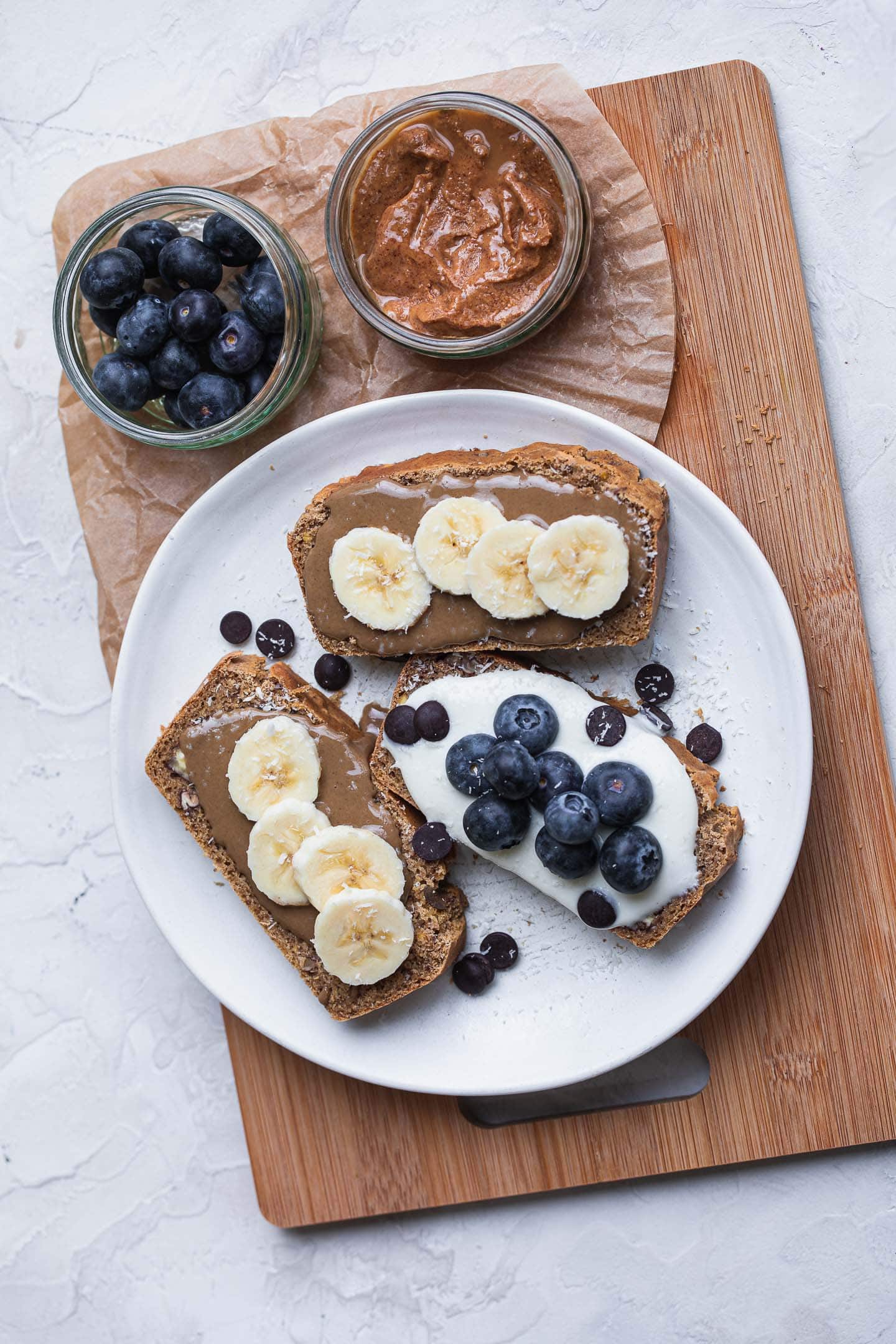 Vegan pecan bread slices with banana and blueberries