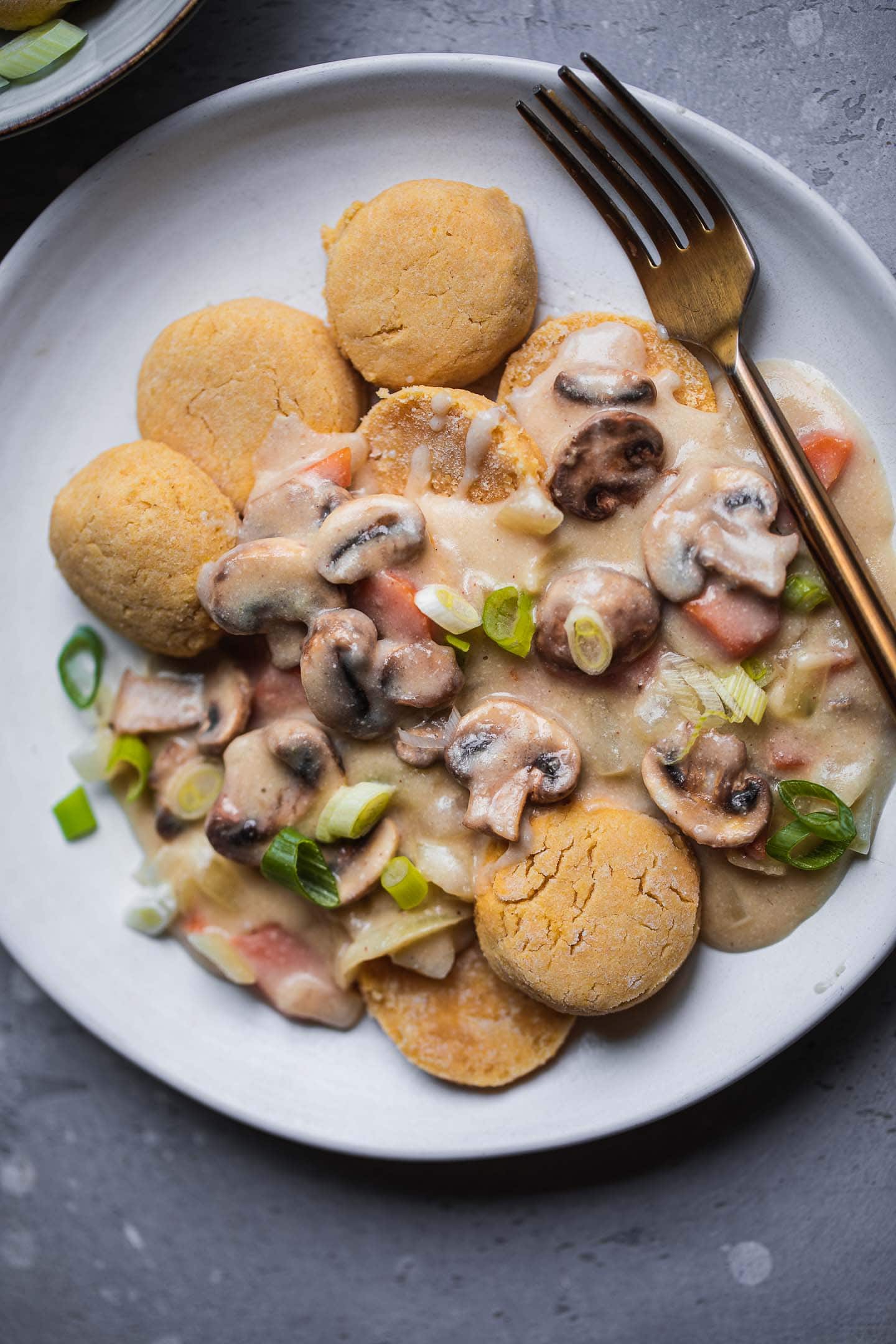 Plate of vegan biscuits with gravy