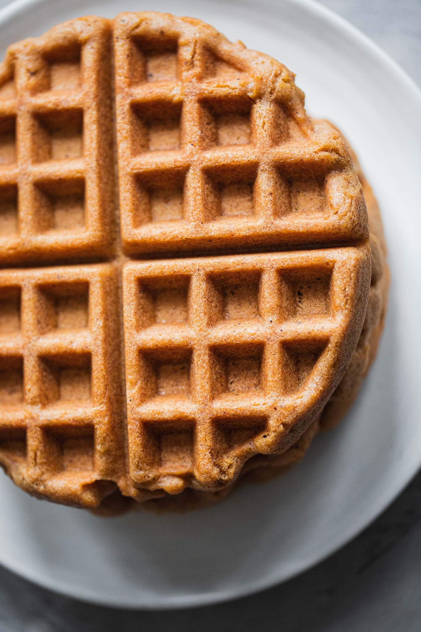 Stack of gluten-free waffles on a plate