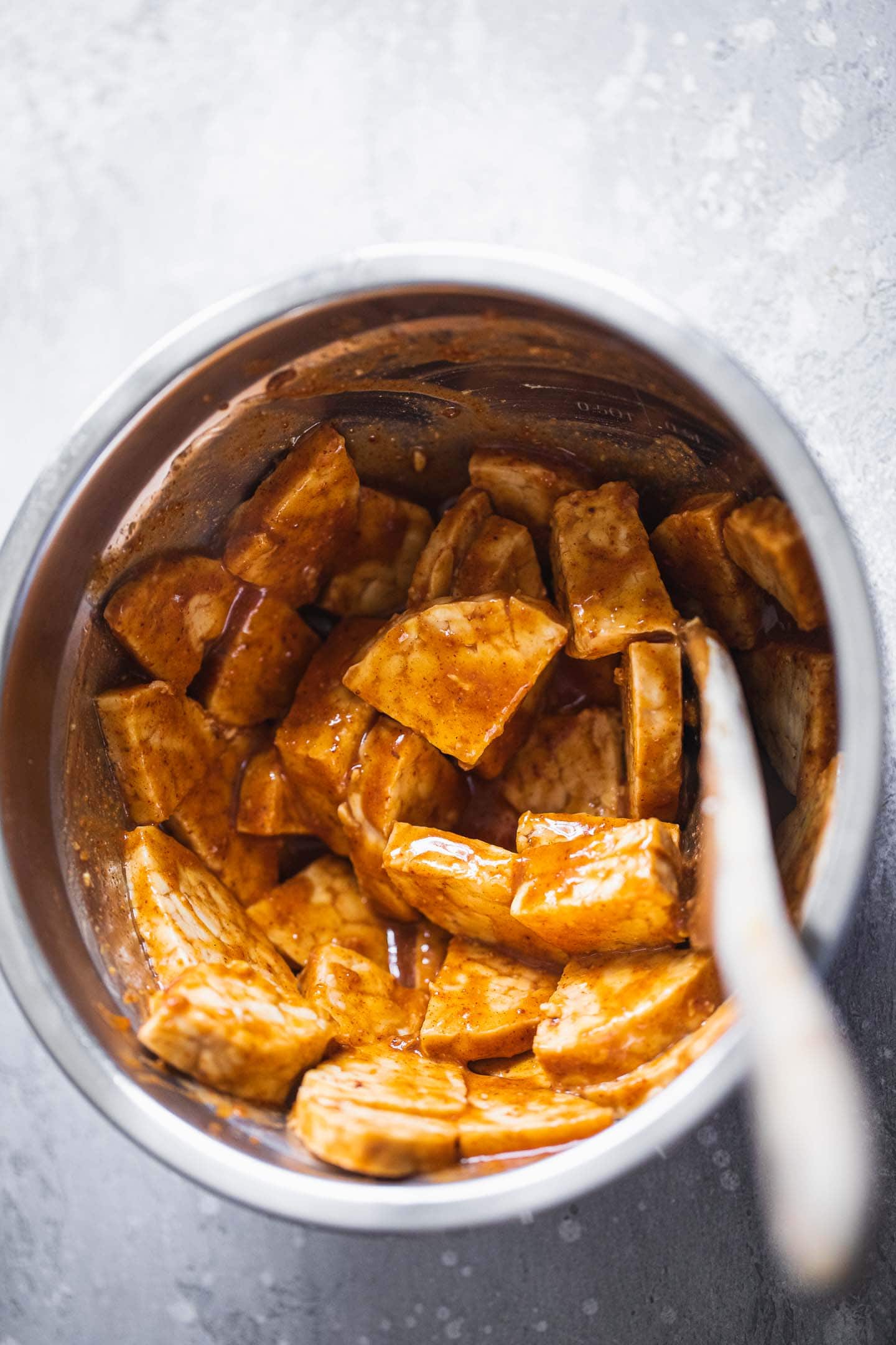 Tempeh in a BBQ sauce in a bowl