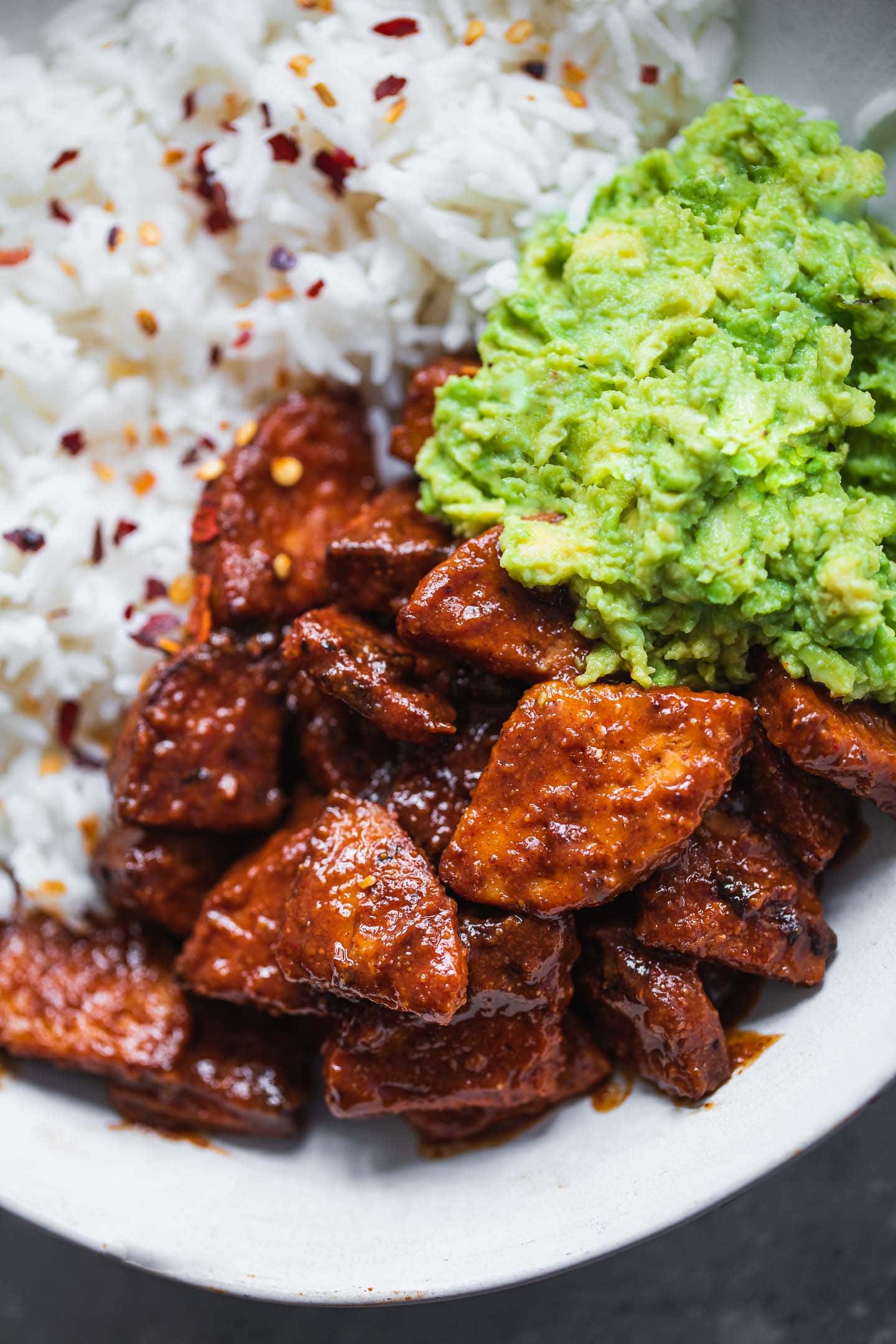 Vegan tempeh with BBQ sauce, avocado and rice