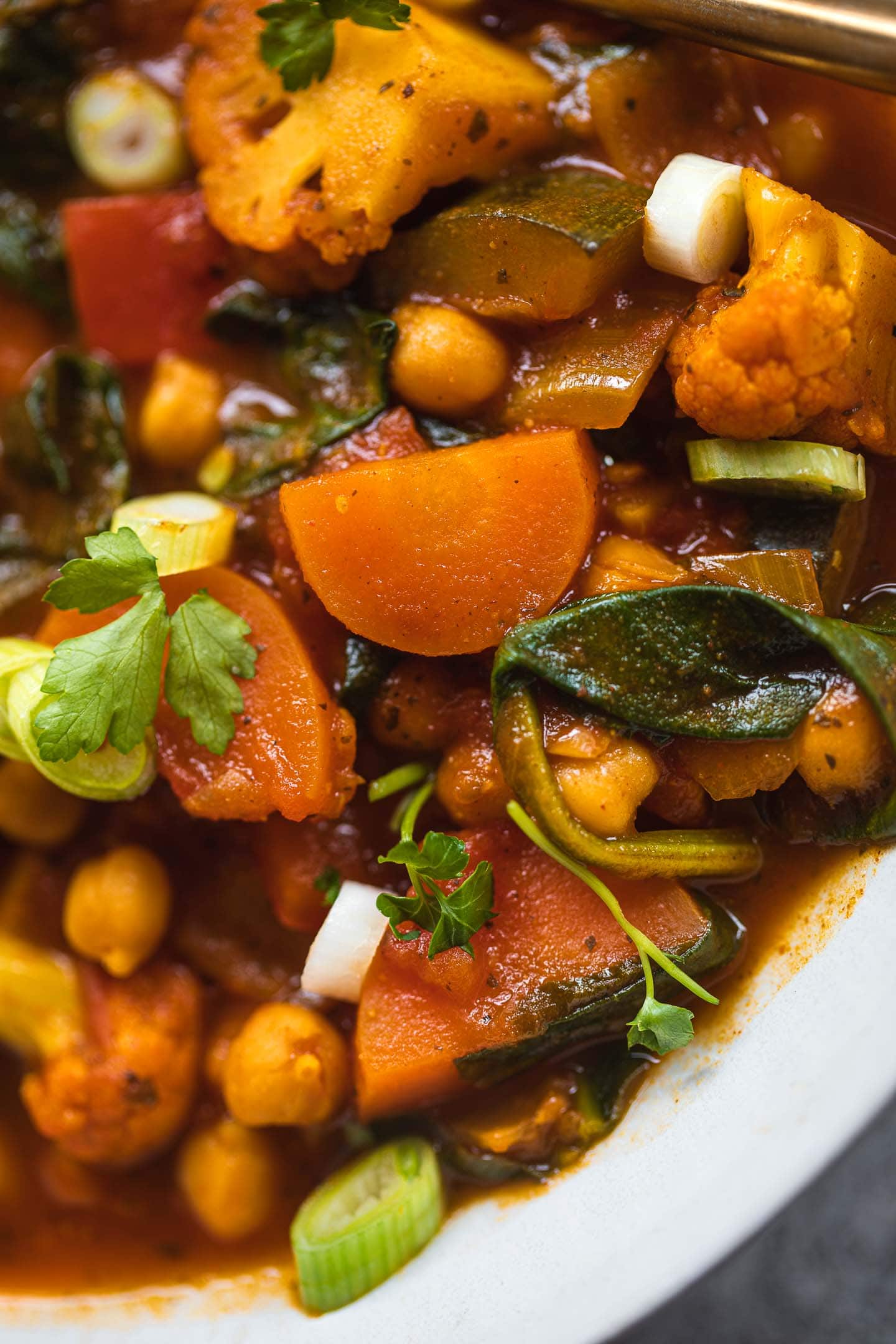 Closeup of a bowl with vegetables and chickpeas