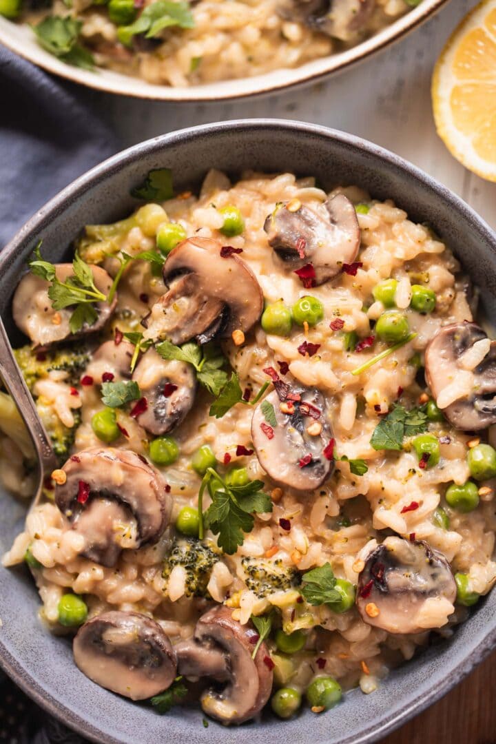 Bowl of dairy-free risotto with peas and broccoli