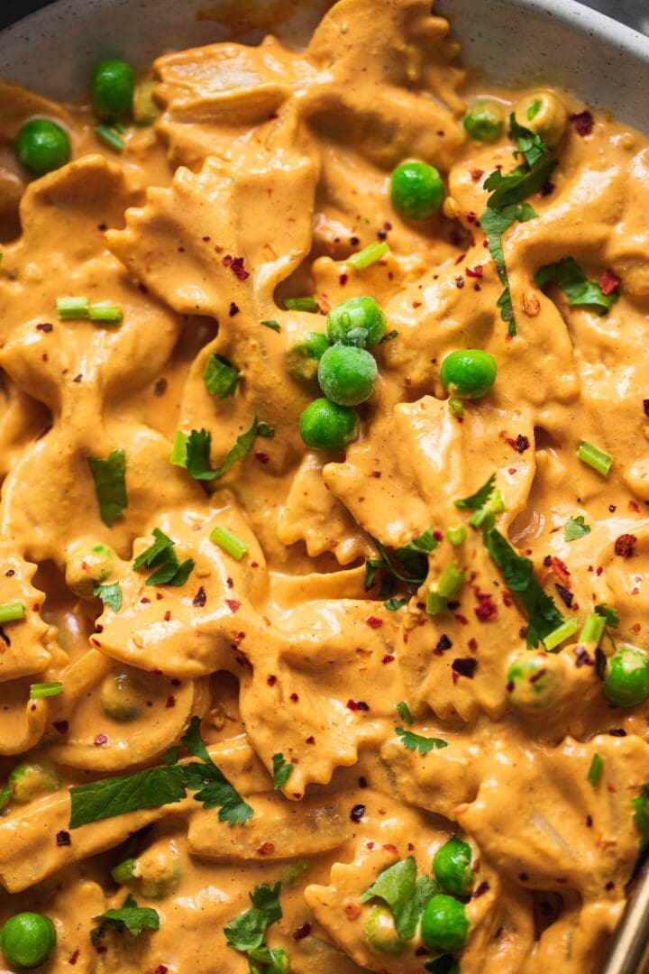 Closeup of pasta with green peas