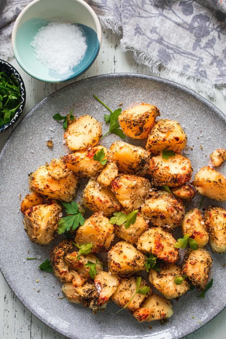 Crispy potatoes with herbs on a plate