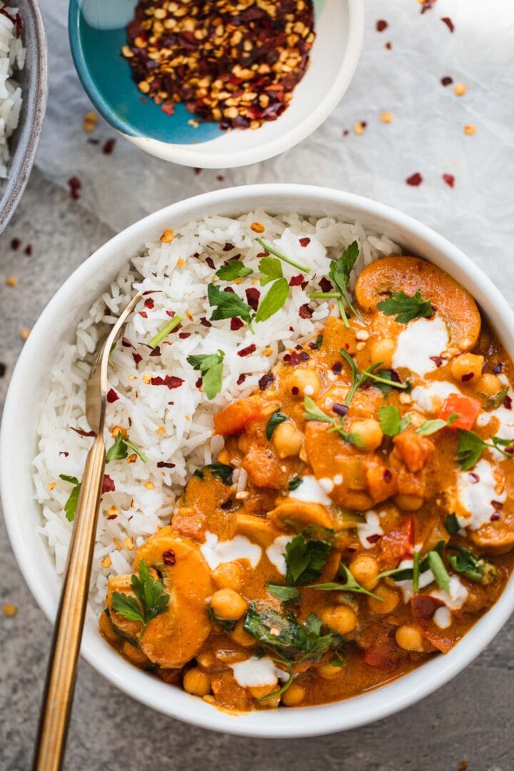 Bowl of vegan curry with spinach and rice