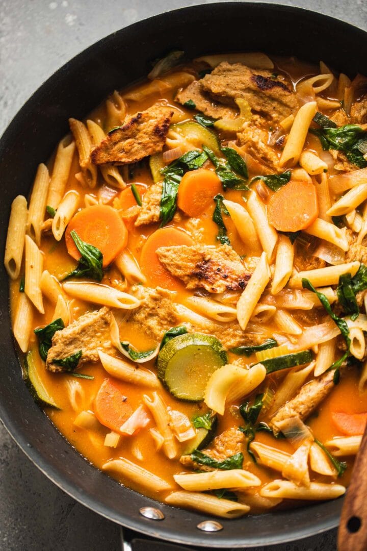 Vegan chicken noodle soup in a frying pan