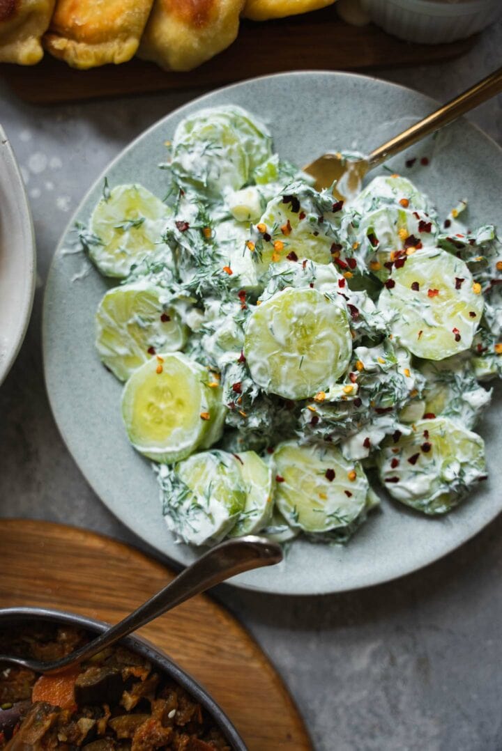 Bowl of Polish cucumber salad and Piroshki
