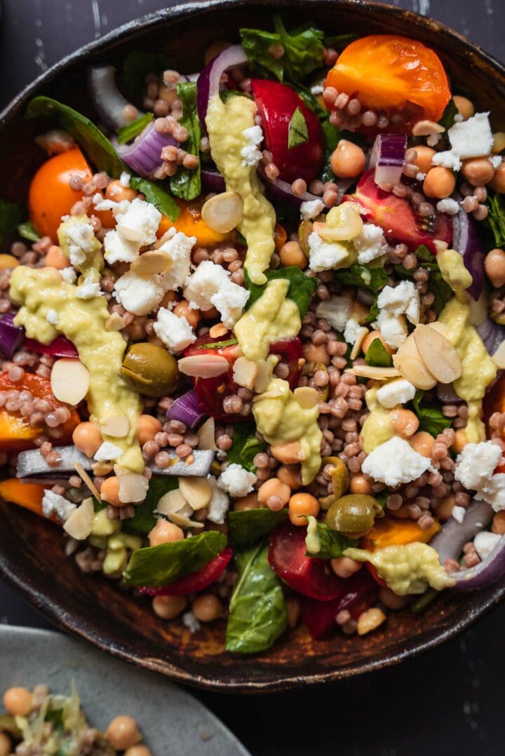 Vegan salad with couscous and avocado sauce