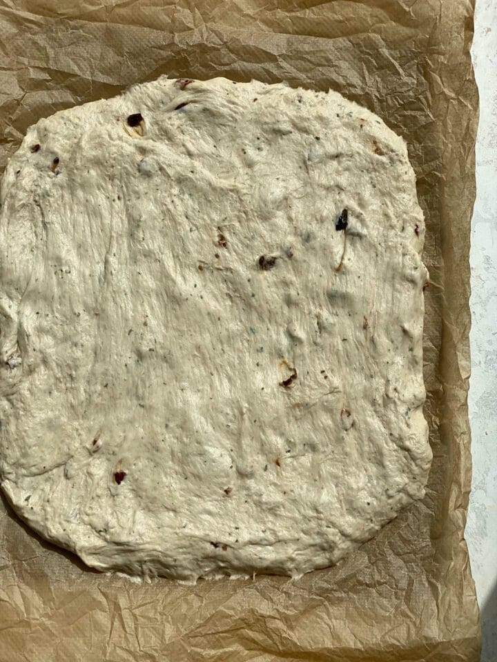 Focaccia dough on a baking tray