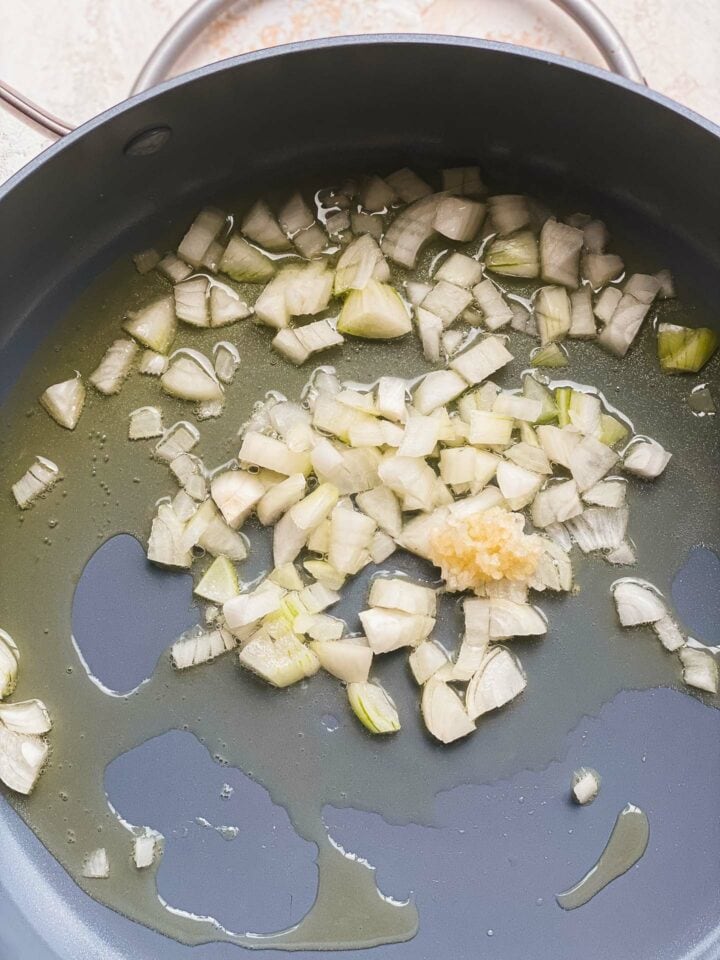 Onion and garlic in a frying pan