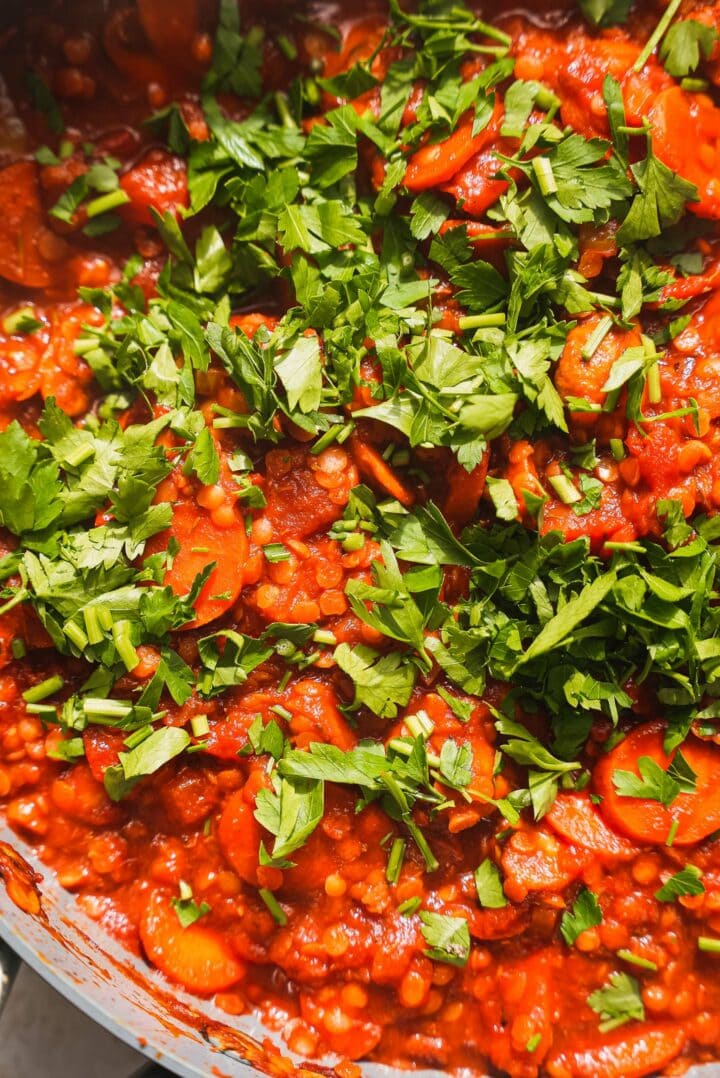 Lentil bolognese with cilantro in a frying pan
