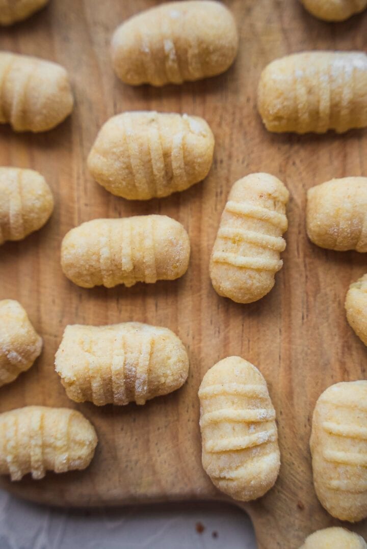 Uncooked gnocchi on a board