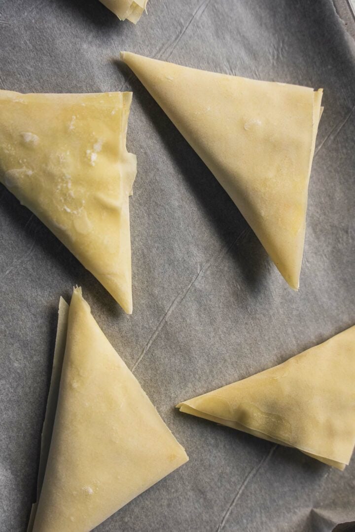 Samosas on a baking tray