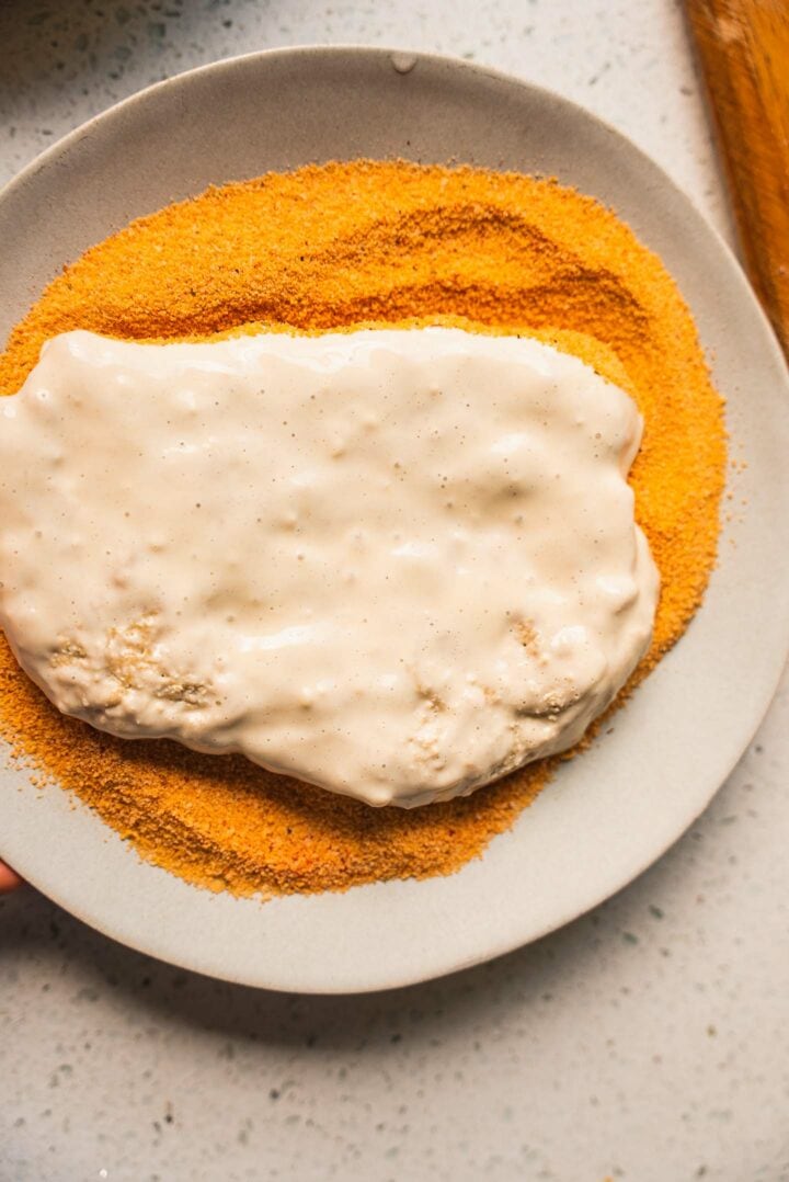 Vegan schnitzel being breaded