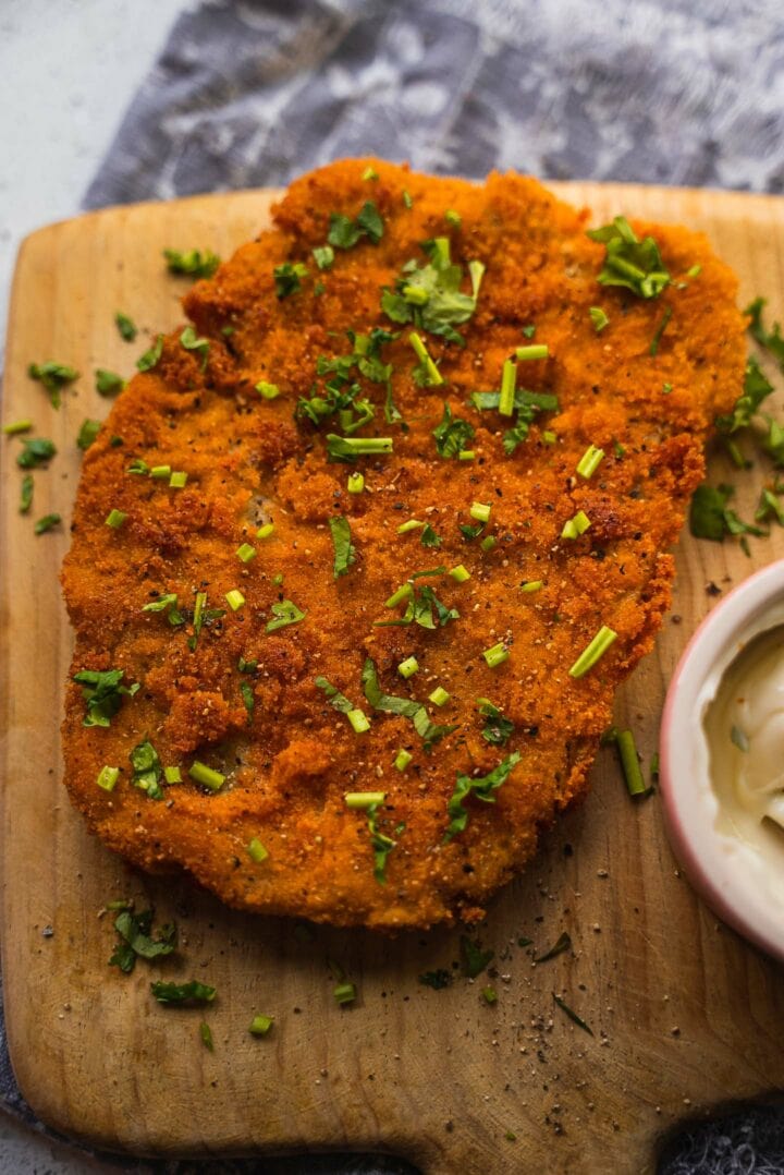Vegan schnitzel on a wooden board